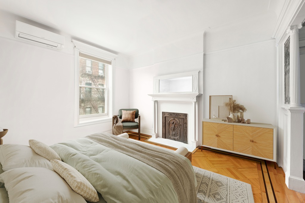 524 3rd Street Brooklyn, NY 11215 - Photo 12 of 18 a bedroom with a bed and a fireplace