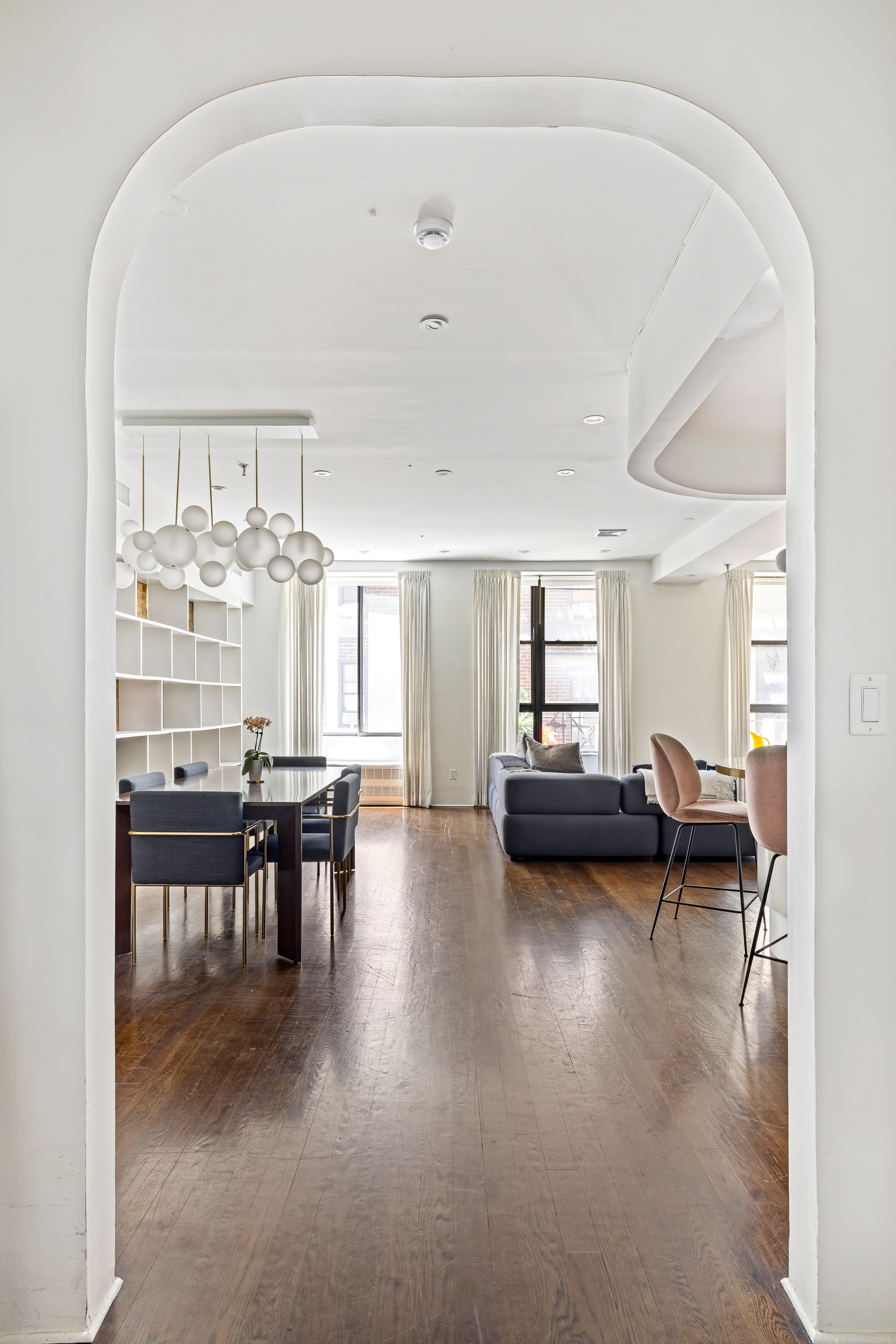 240 West 23rd Street, Unit 3/4C Manhattan, NY 10011 - Photo 6 of 13 a dining room with furniture and wooden floor