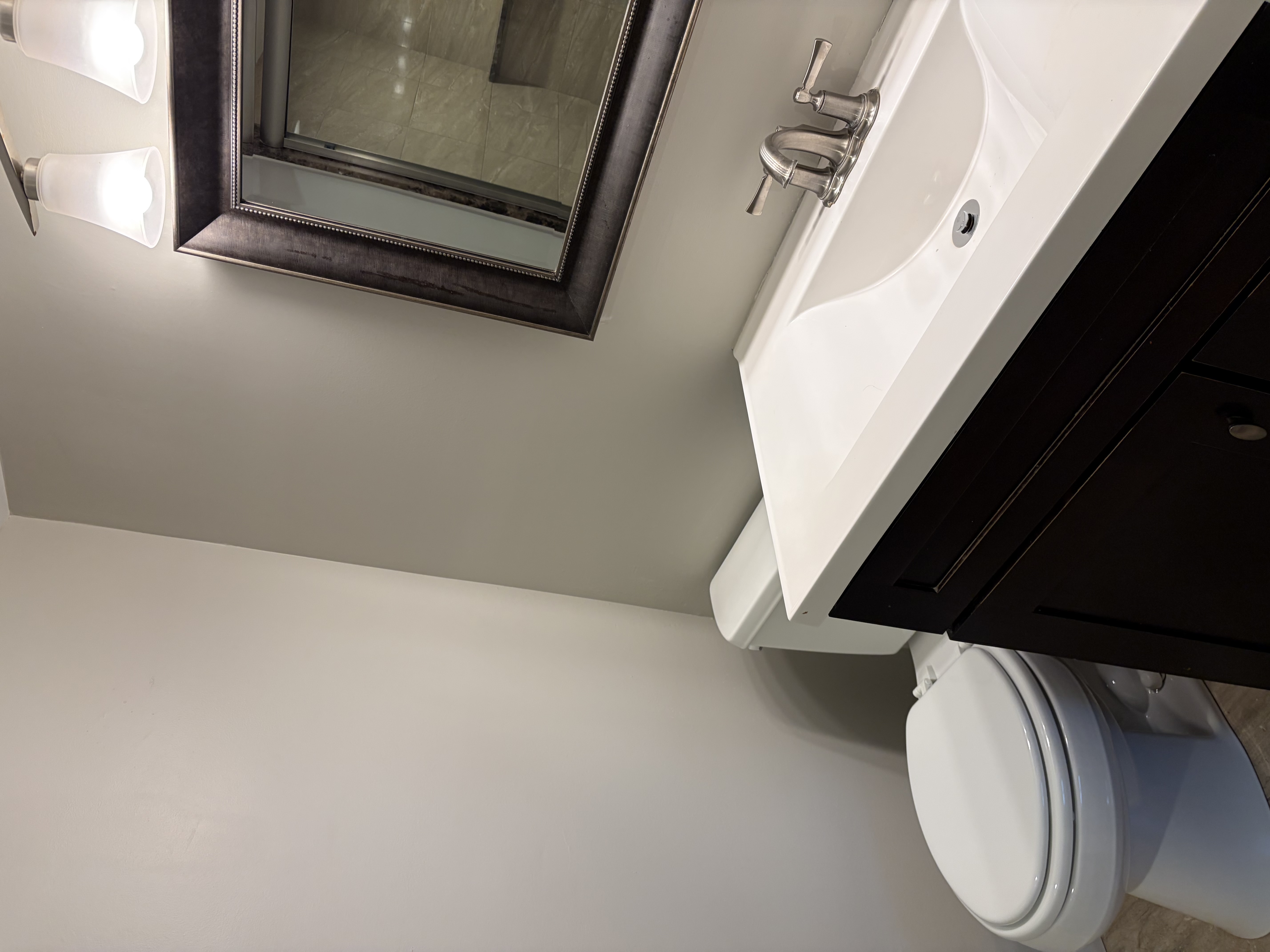 312 B Windsor Avenue, Unit B Narberth, PA 19072 - Photo 12 of 12 a bathroom with a sink a toilet and mirror