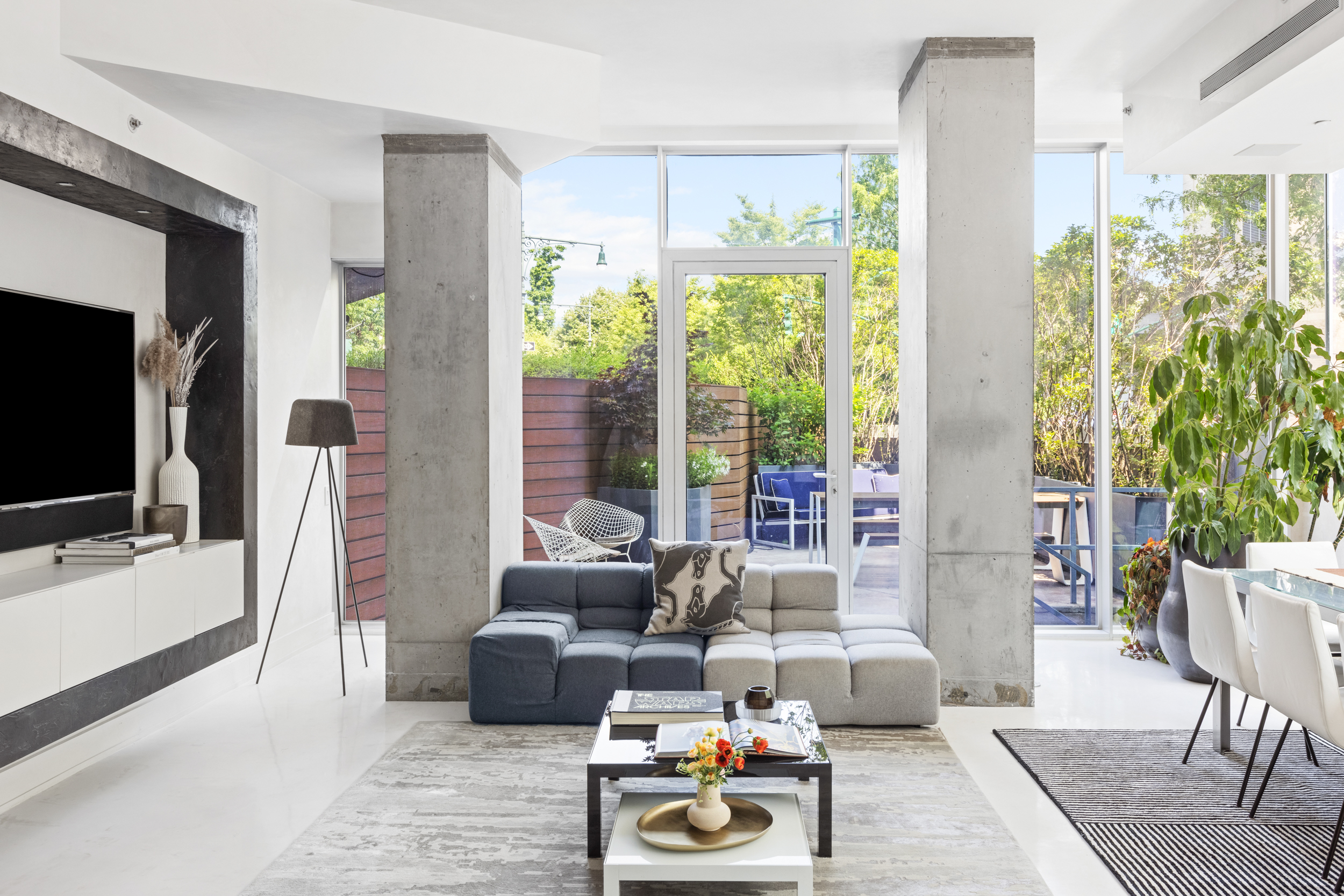 a living room with furniture and a flat screen tv