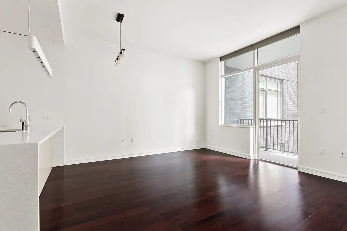 a view of a livingroom with wooden floor