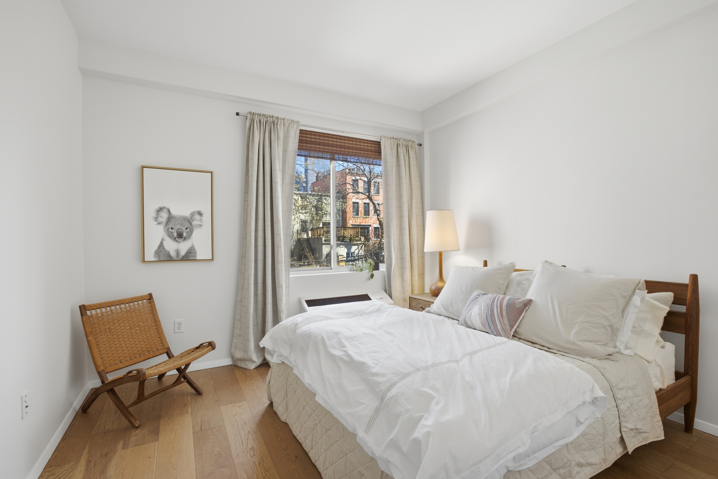 433 Warren Street, Unit 2C Brooklyn, NY 11217 - Photo 5 of 19 a bedroom with a bed and a desk