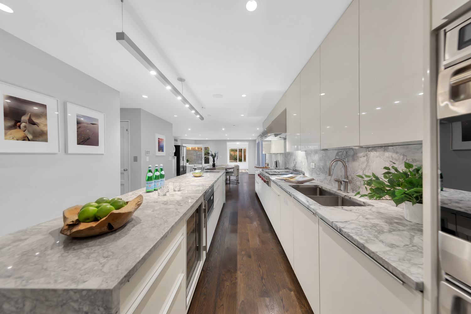 42 West 71st Street Manhattan, NY 10023 - Photo 9 of 35 a view of a kitchen with kitchen island stainless steel appliances sink stove and wooden floor