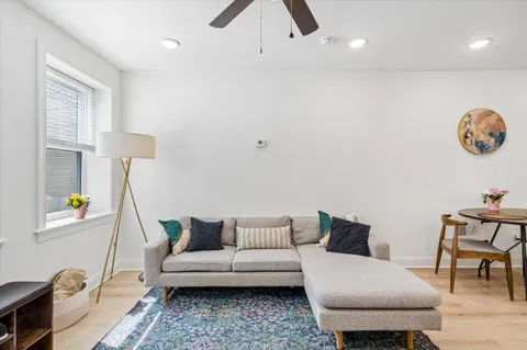 a living room with furniture and a table