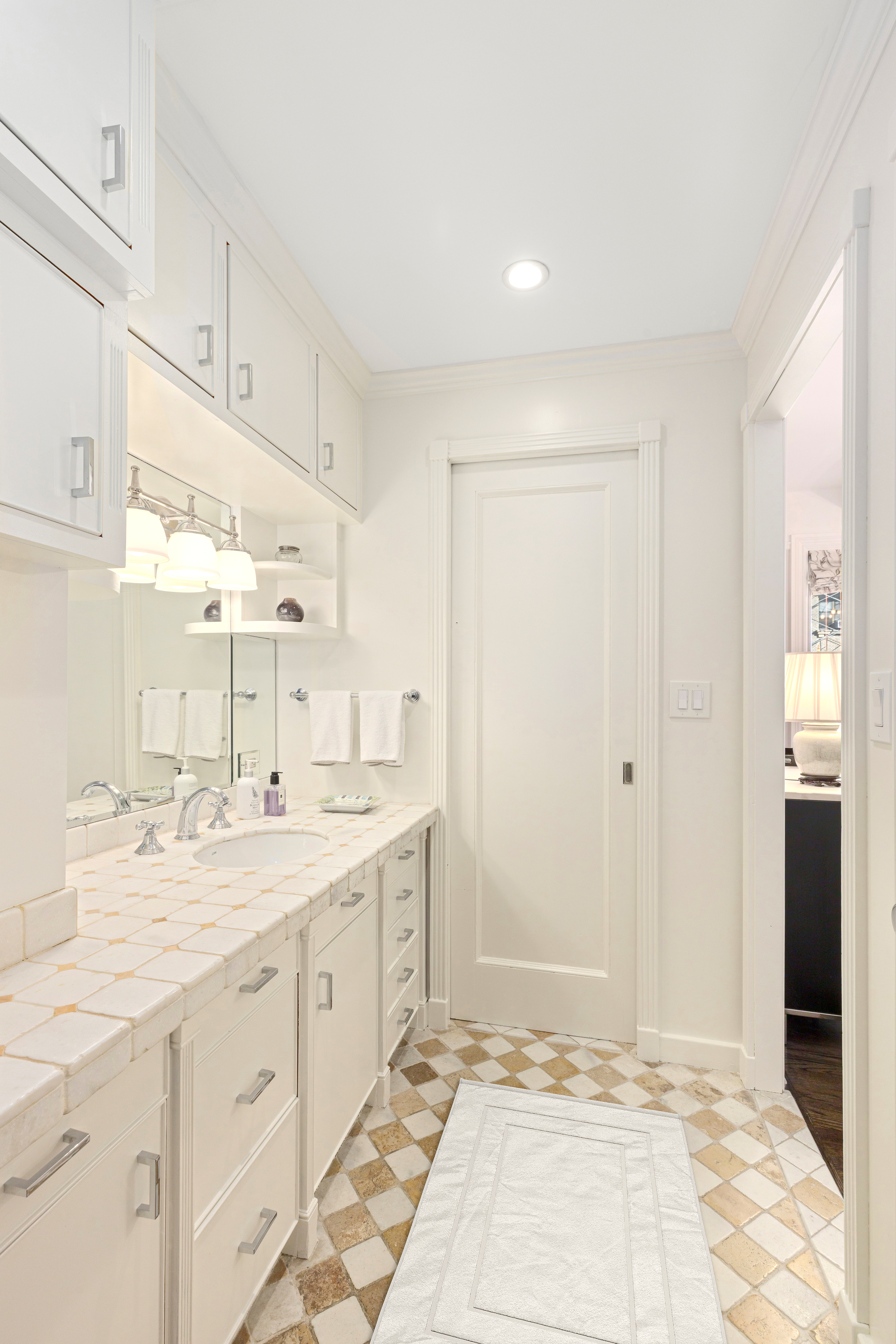 515 West End Avenue, Unit 8B Manhattan, NY 10024 - Photo 8 of 12 a bathroom with a sink shower and a mirror