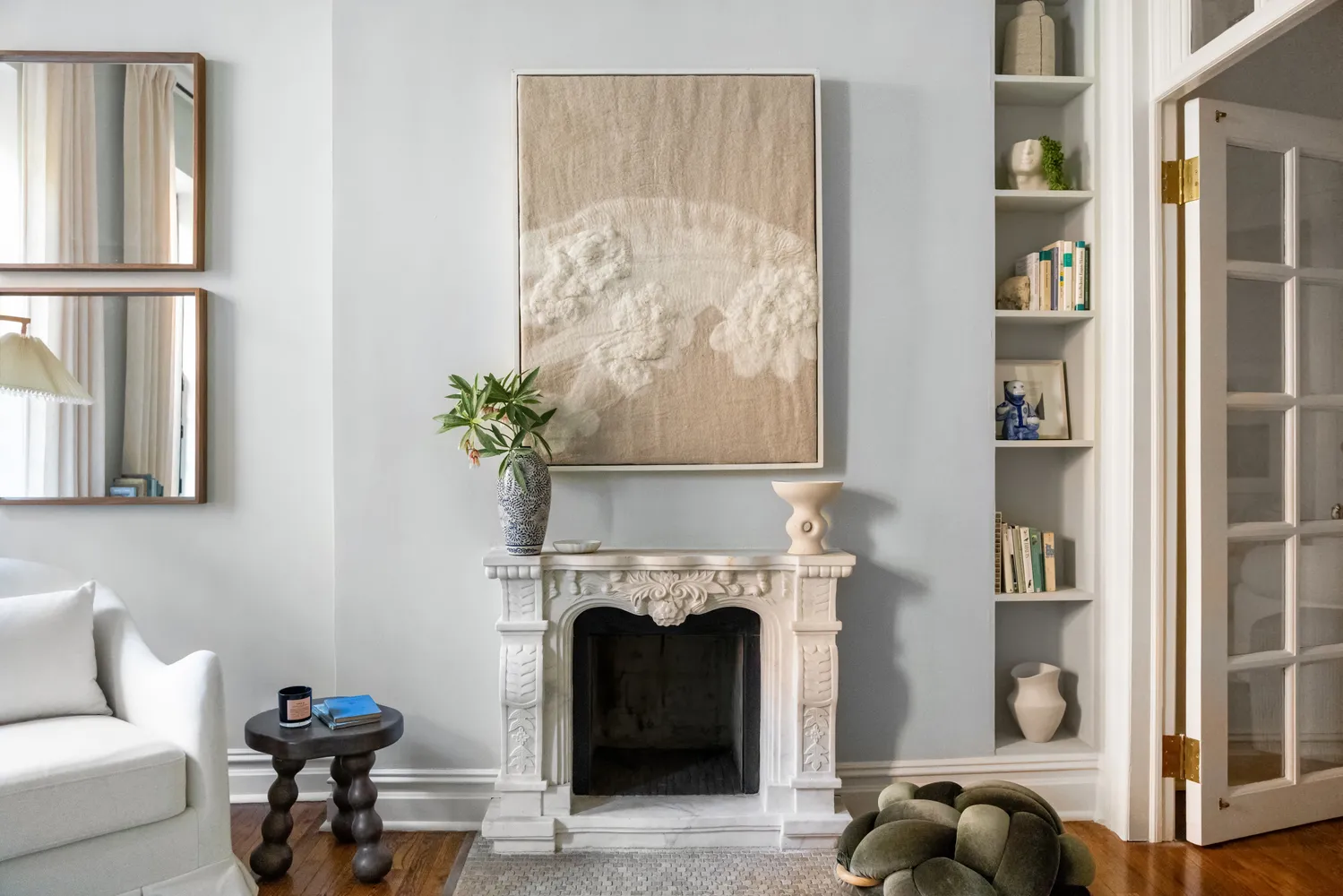 a living room with furniture and a fireplace