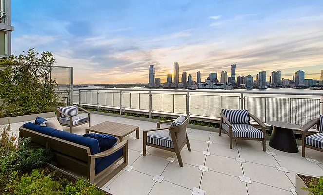 20 River Terrace, Unit 22A Manhattan, NY 10282 - Photo 23 of 27 a view of a terrace with furniture