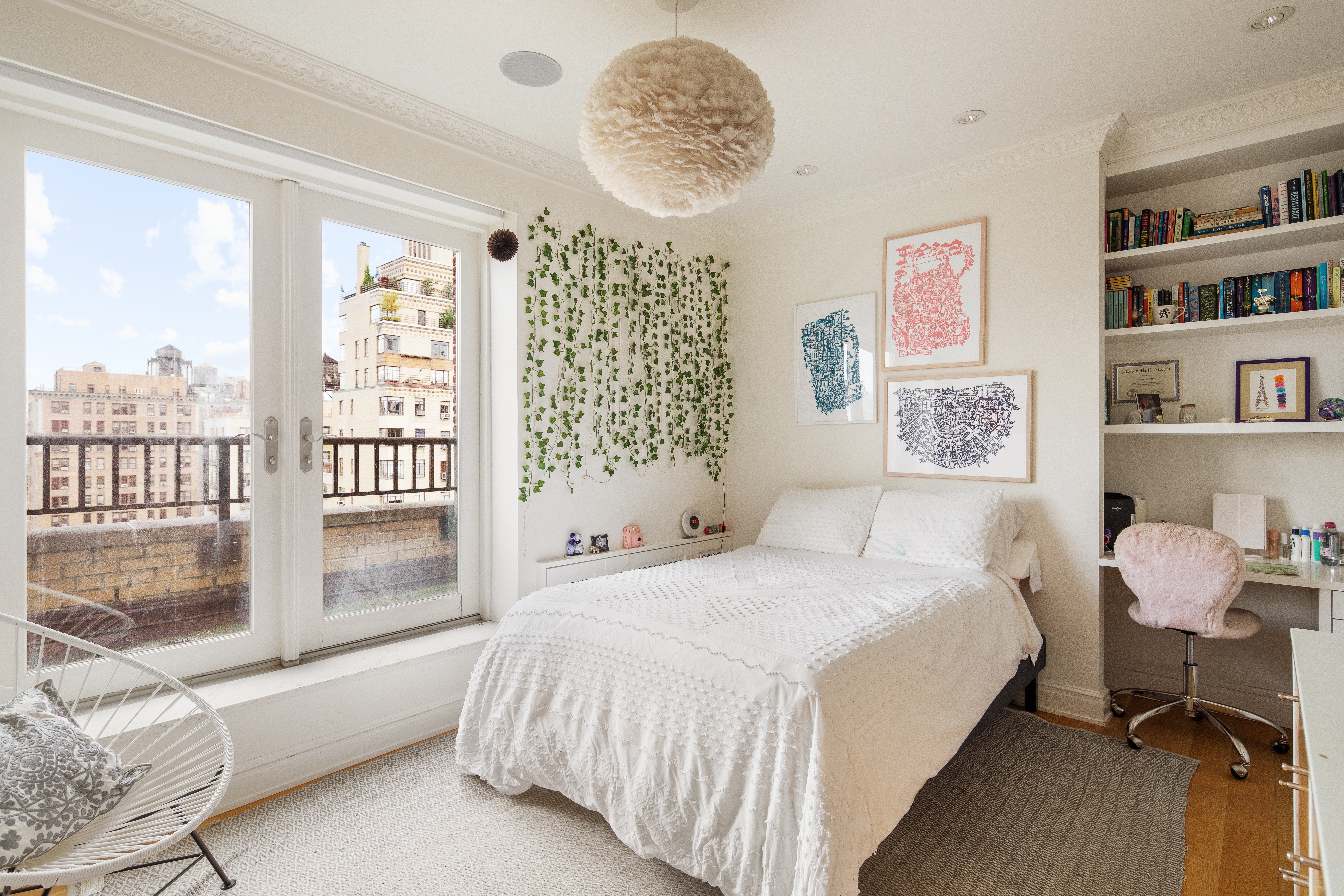 309 West 86th Street, Unit PH Manhattan, NY 10024 - Photo 10 of 16 a bedroom with a bed a table and a large window