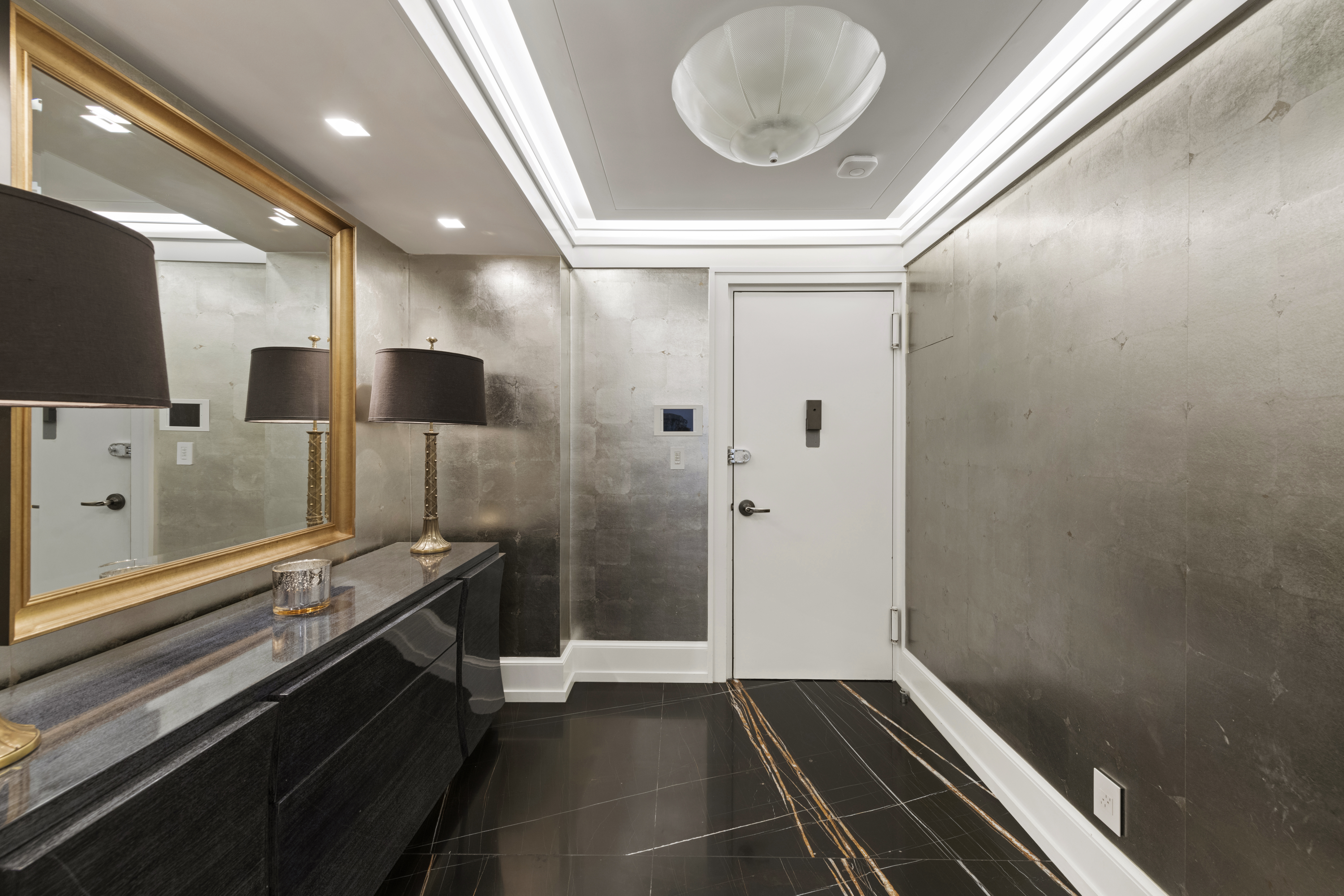 180 East End Avenue, Unit 15E Manhattan, NY 10128 - Photo 19 of 31 a kitchen with a refrigerator and a stove