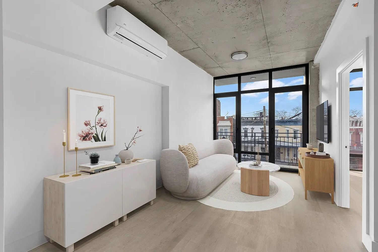 a living room with furniture and a flat screen tv