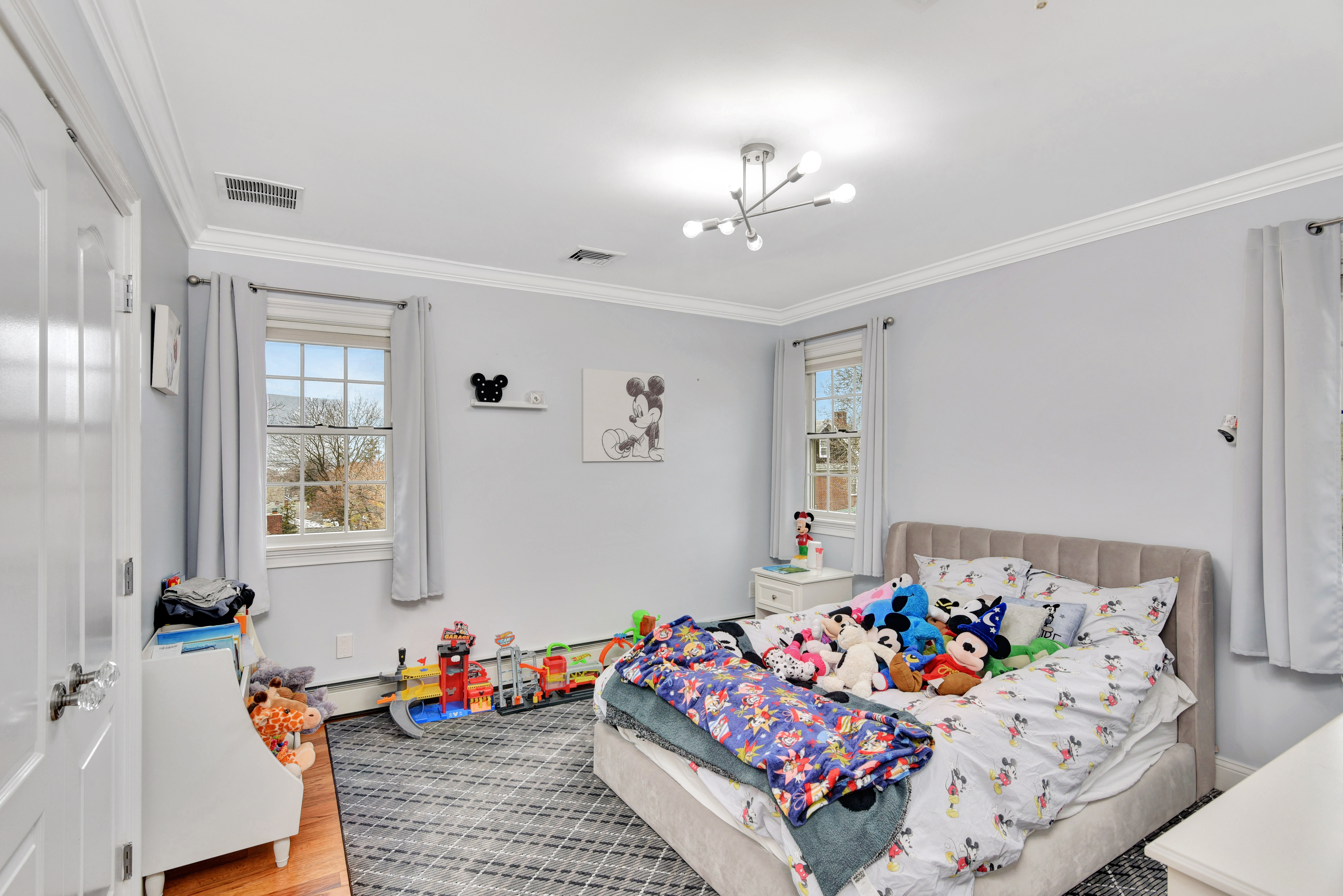 215 Lawrence Avenue Staten Island, NY 10310 - Photo 21 of 45 a bedroom with furniture and a chandelier fan
