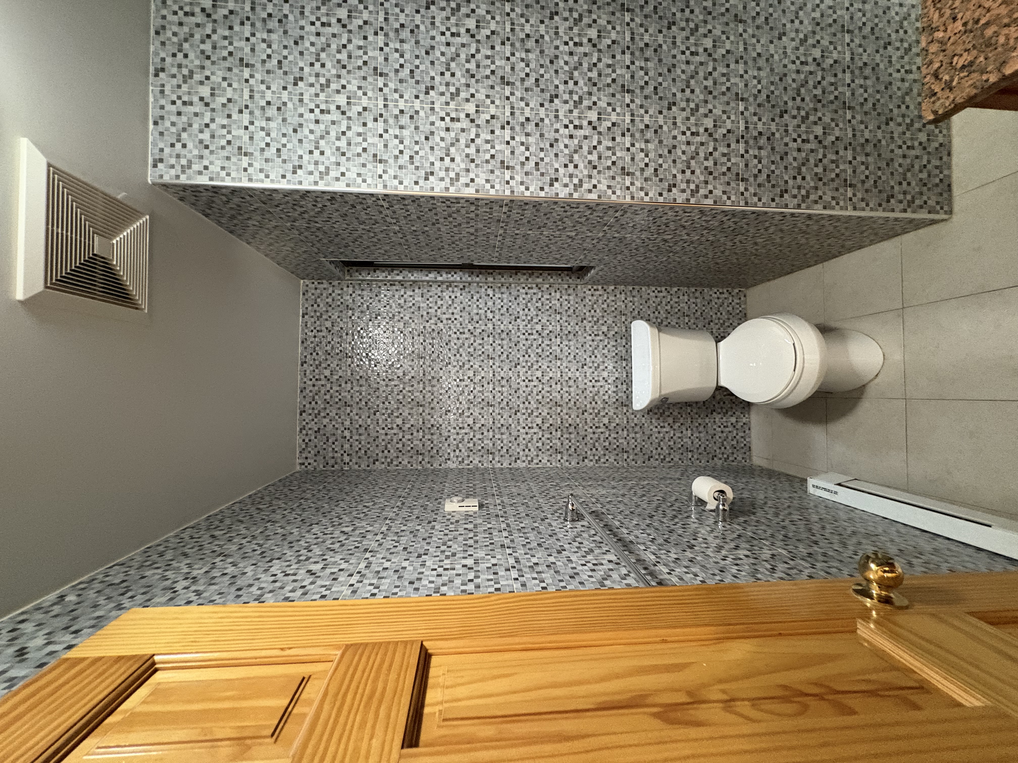 38 Ludlow Street, Unit 15 Manhattan, NY 10002 - Photo 13 of 16 a bathroom with a toilet and a shower