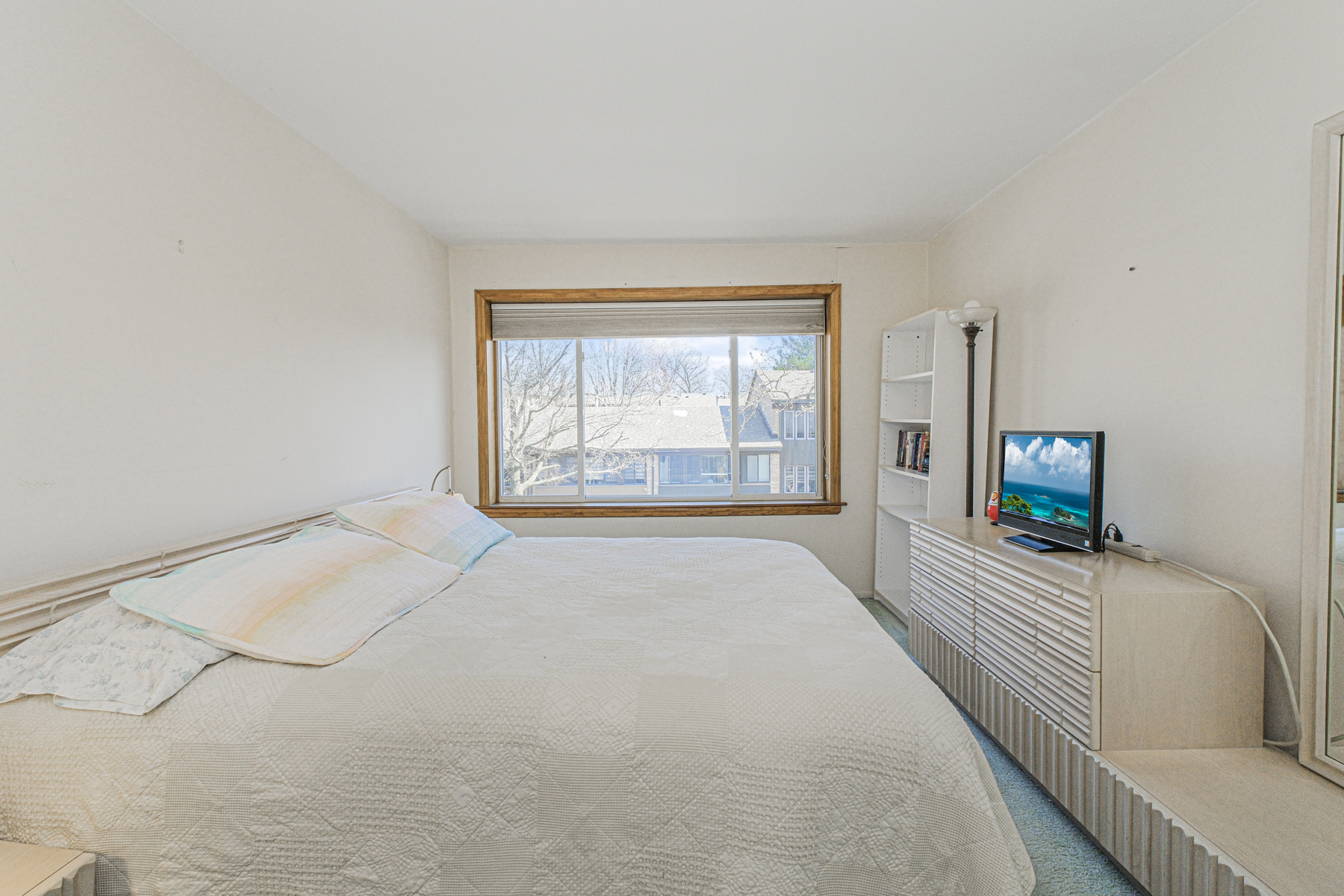 97 Dogwood Lane Staten Island, NY 10305 - Photo 9 of 22 a view of a bedroom with furniture and a flat screen tv
