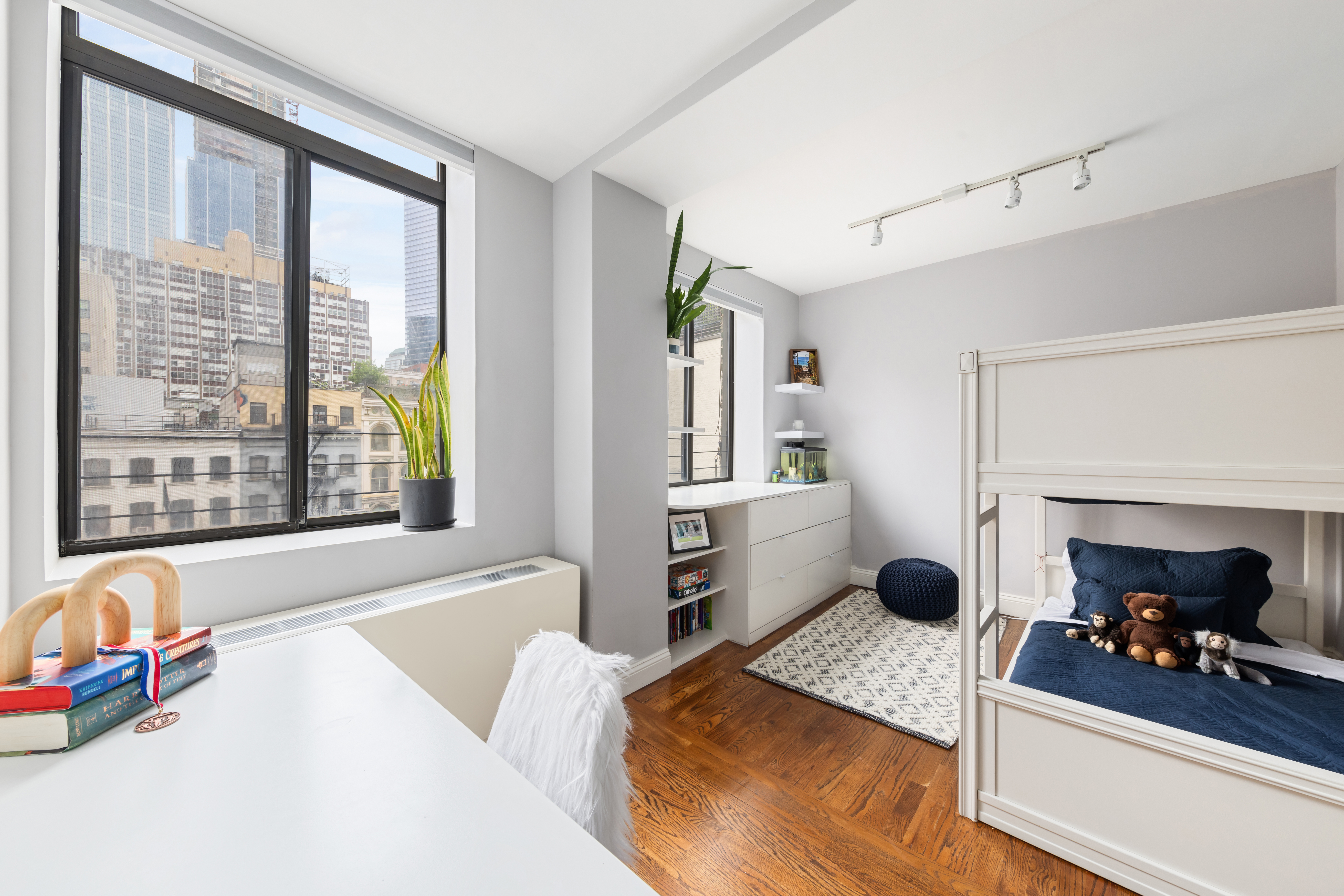 99 Reade Street, Unit 5E Manhattan, NY 10013 - Photo 9 of 13 a bedroom with a bed and a large window