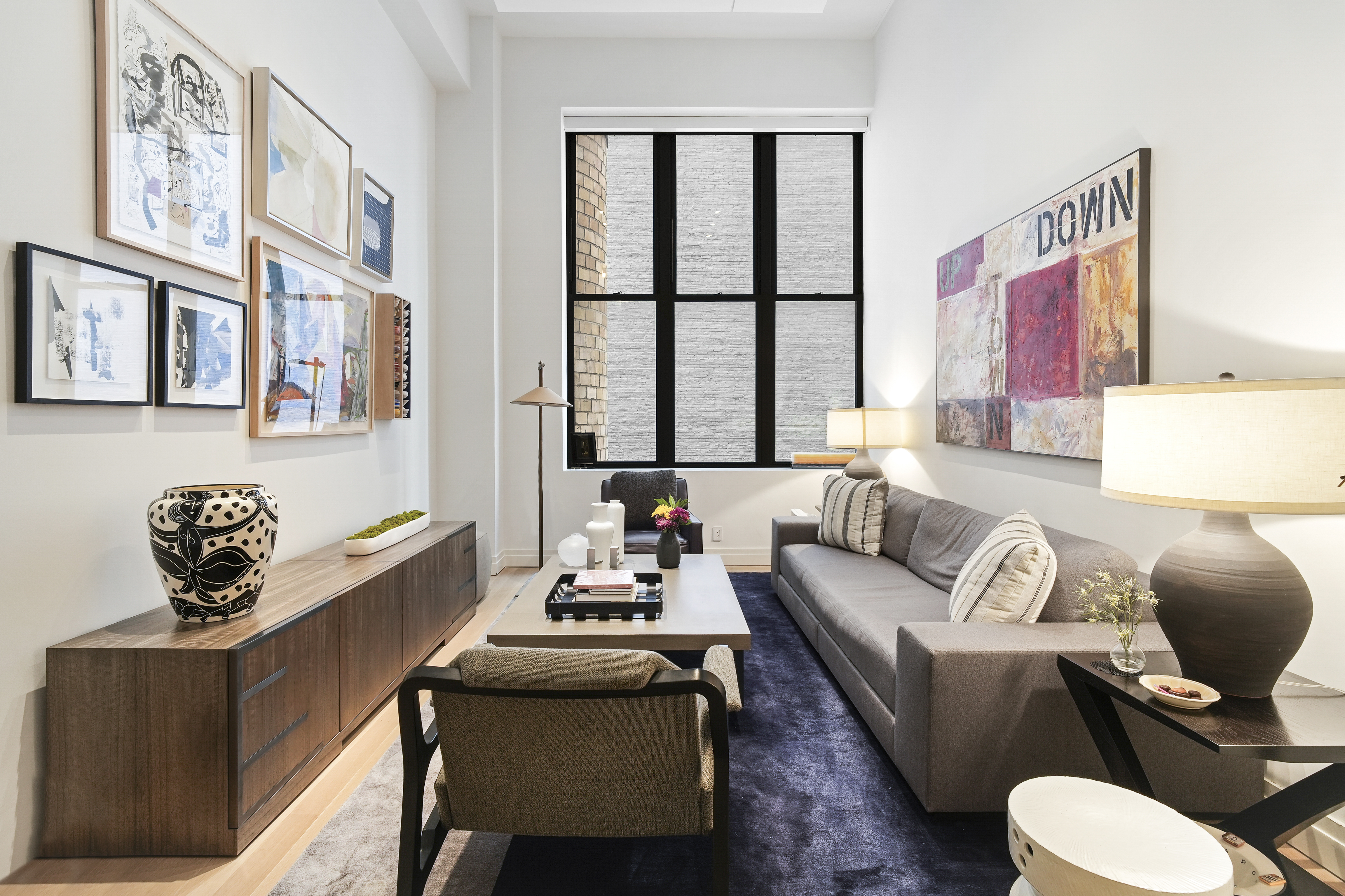 421 Hudson Street, Unit 221 Manhattan, NY 10014 - Photo 4 of 21 a living room with furniture and a window