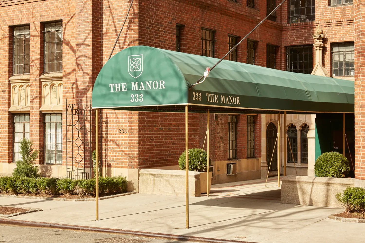 a view of a brick building with a window and door