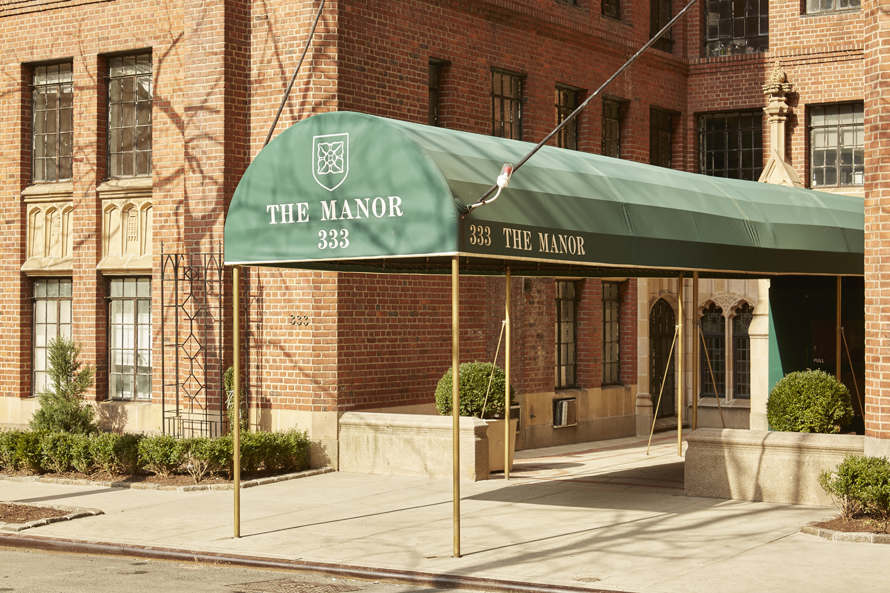 333 East 43rd Street, Unit 508 Manhattan, NY 10017 - Photo 7 of 8 a view of a brick building with a window and door