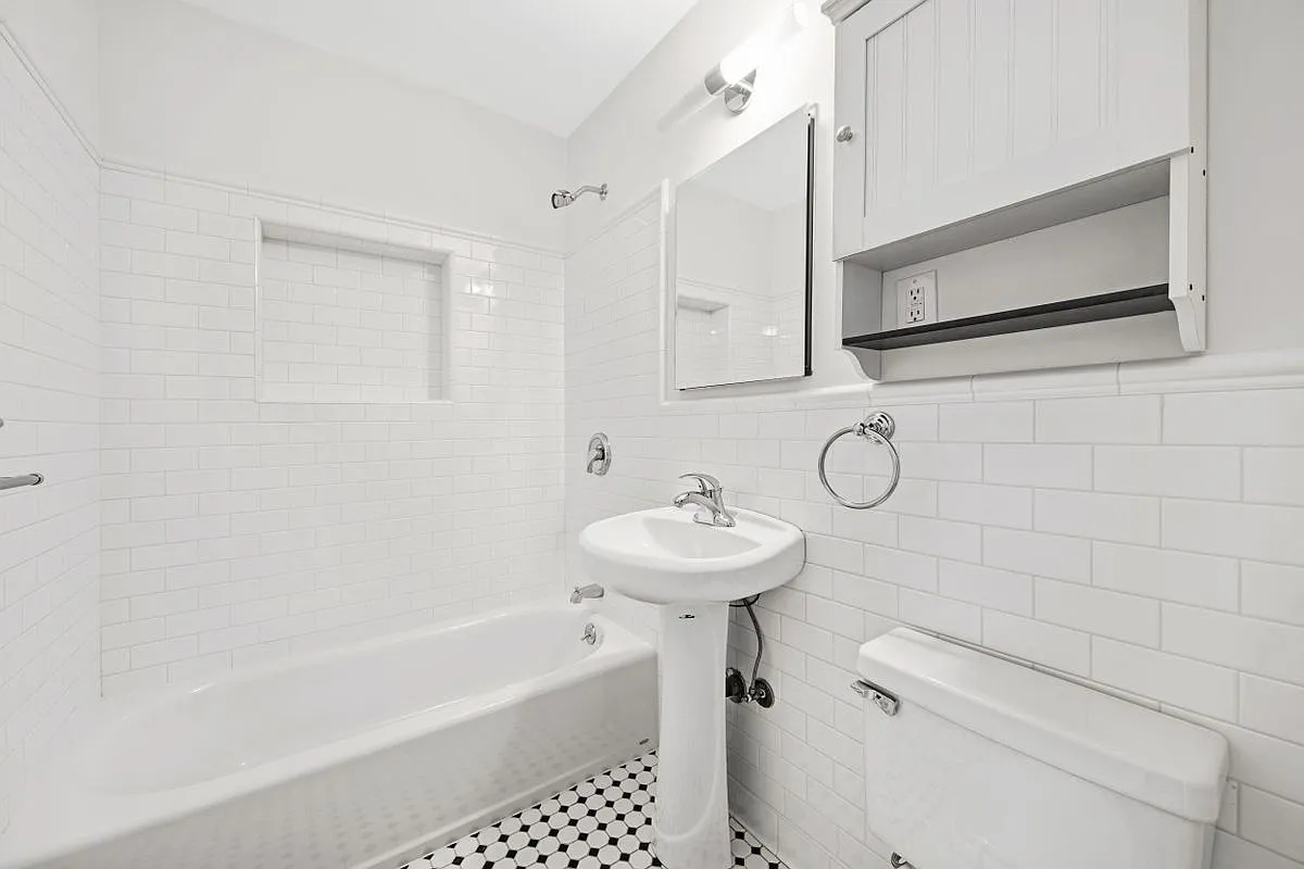 138 Baltic Street, Unit 3C Brooklyn, NY 11201 - Photo 5 of 10 a bathroom with a sink a toilet and bathtub
