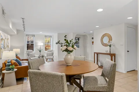 a bedroom with a bed and a potted plant