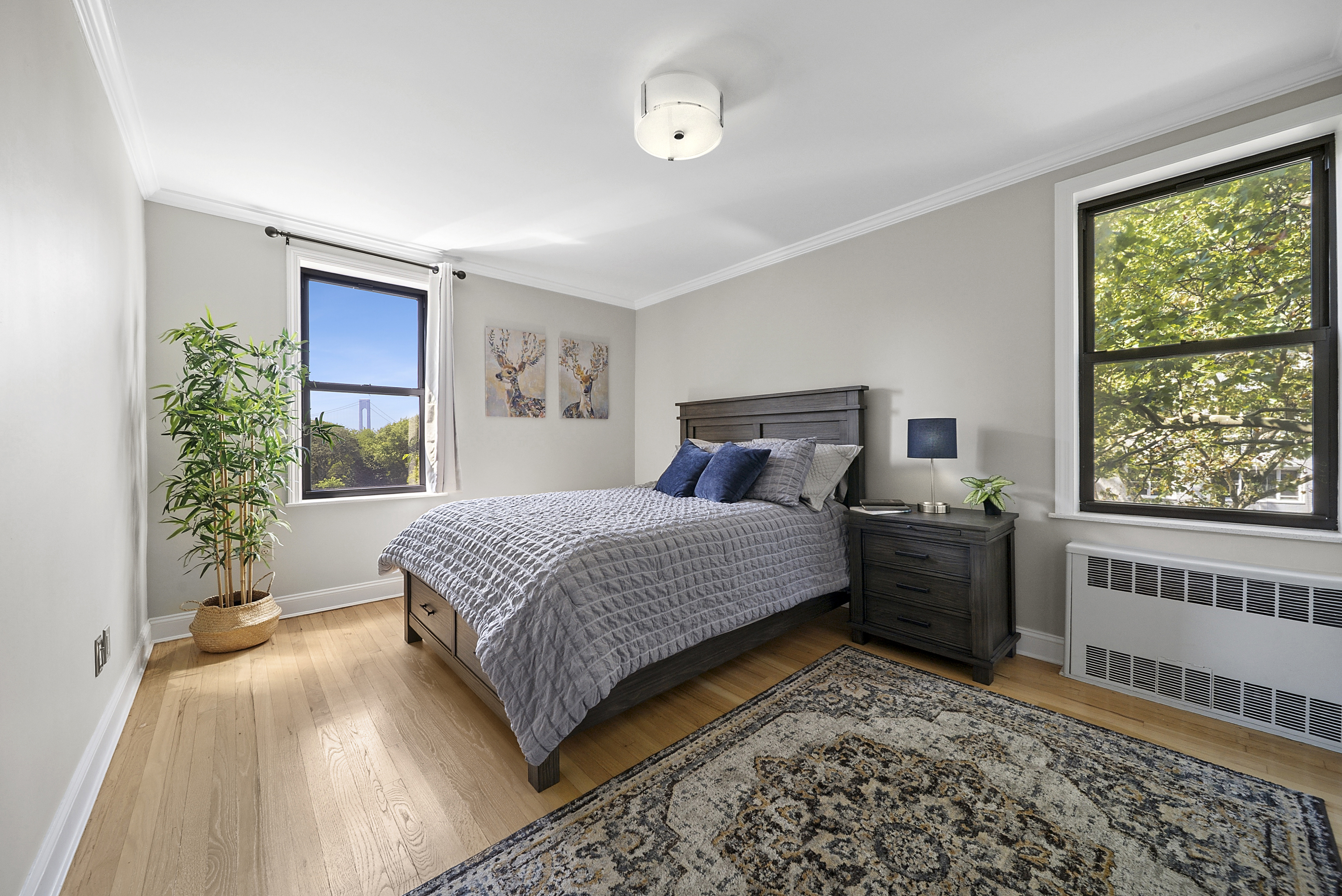 20 89th Street, Unit 5C Brooklyn, NY 11209 - Photo 3 of 9 a bedroom with a bed and a window