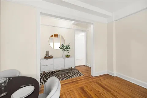 a bedroom with a bed and a mirror