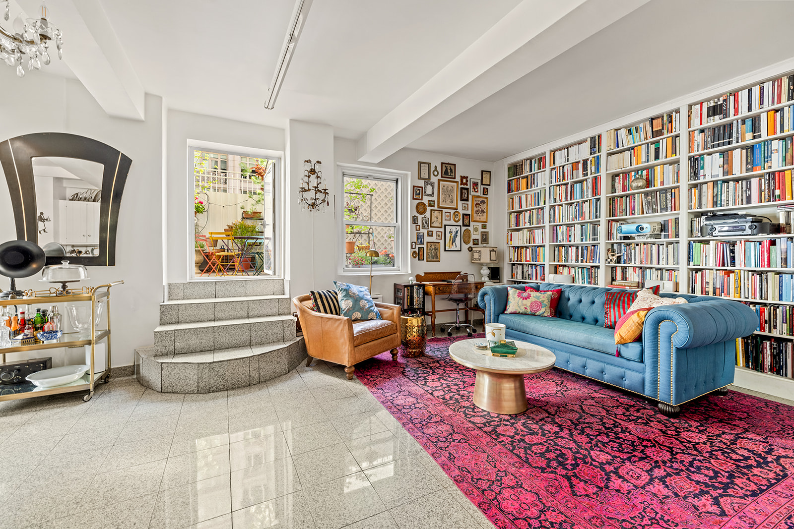 2166 Broadway, Unit 4C Manhattan, NY 10024 - Photo 3 of 10 a living room with furniture stairs and a flat screen tv