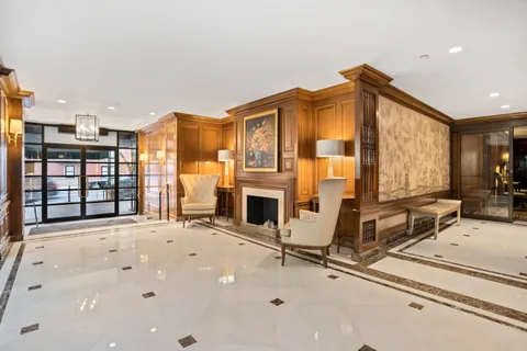 a view of a livingroom with furniture and a fireplace