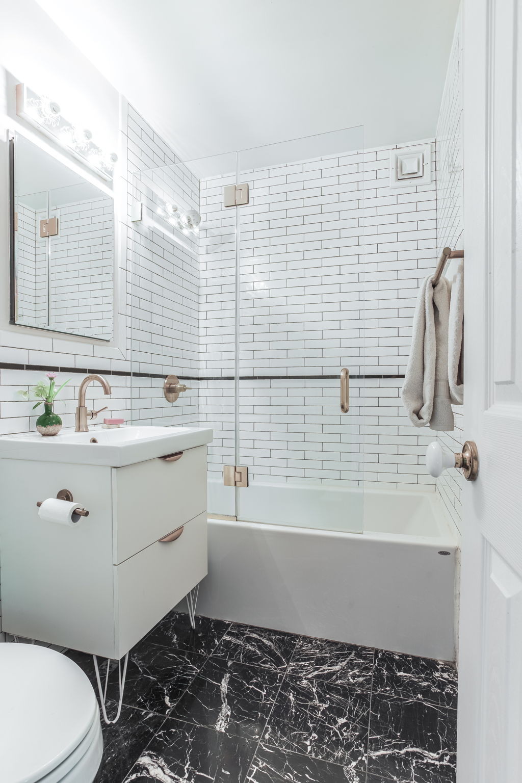 427 St Johns Place, Unit 2B Brooklyn, NY 11238 - Photo 7 of 11 a bathroom with a sink toilet and shower