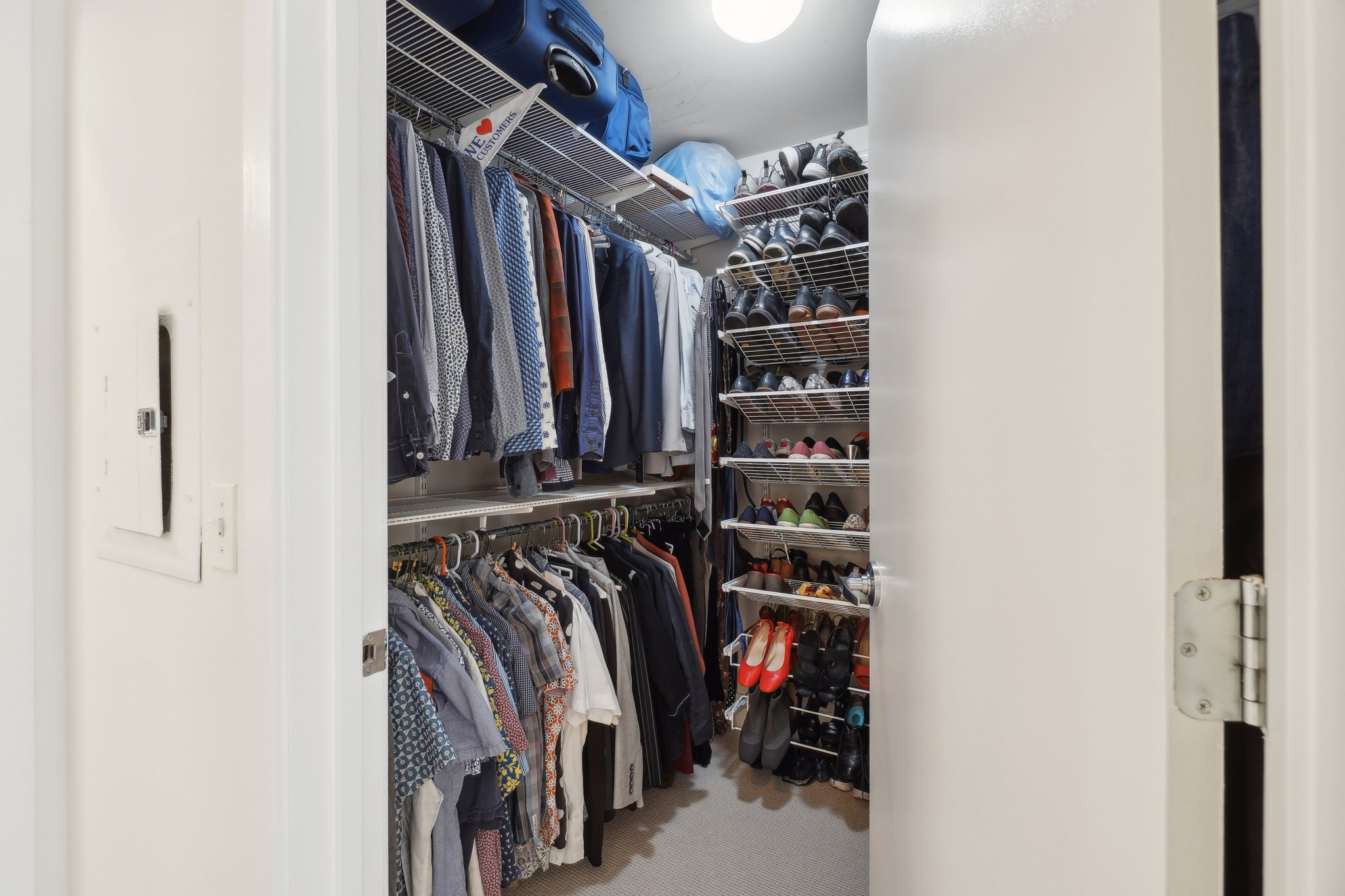 2120 Vermont Avenue Northwest, Unit 309 Washington, DC 20001 - Photo 13 of 26 a view of walk in closet with clothes and shoes
