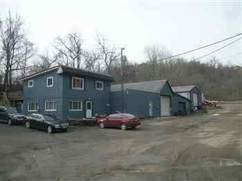 13 Forsythe Road Presto, PA 15142 - Photo 2 of 2 a front view of a house with a garden and mountain view