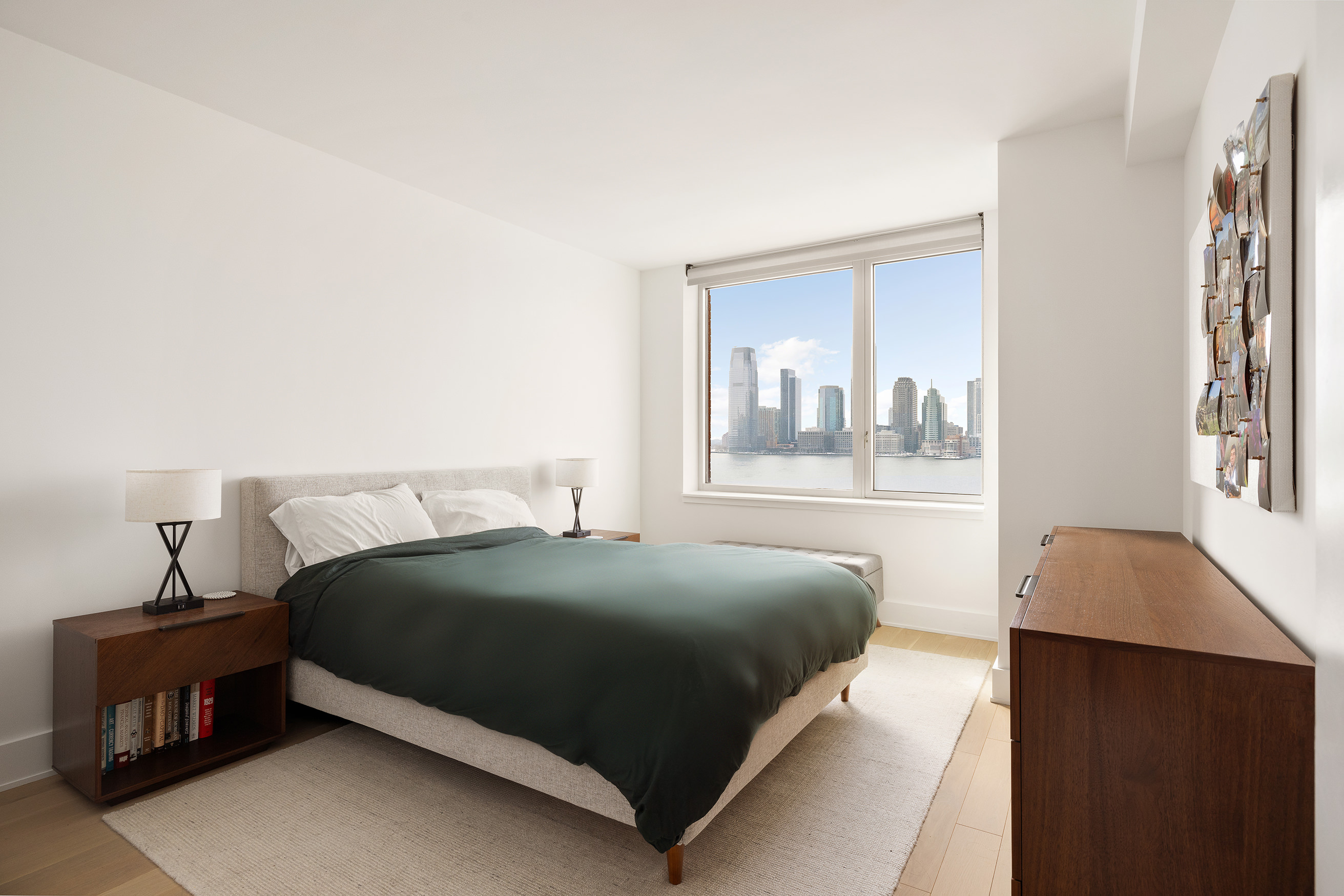 20 River Terrace, Unit 10G Manhattan, NY 10282 - Photo 4 of 21 a bedroom with a bed and window