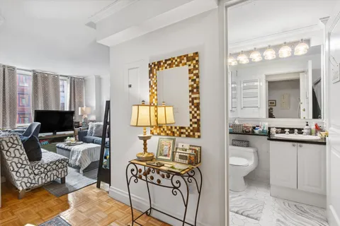 a living room with furniture or couch and a flat screen tv