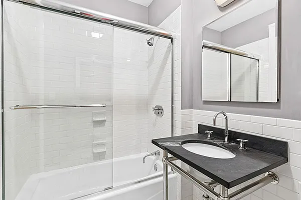 110 Livingston Street, Unit 17K Brooklyn, NY 11201 - Photo 7 of 11 a bathroom with a sink and a mirror