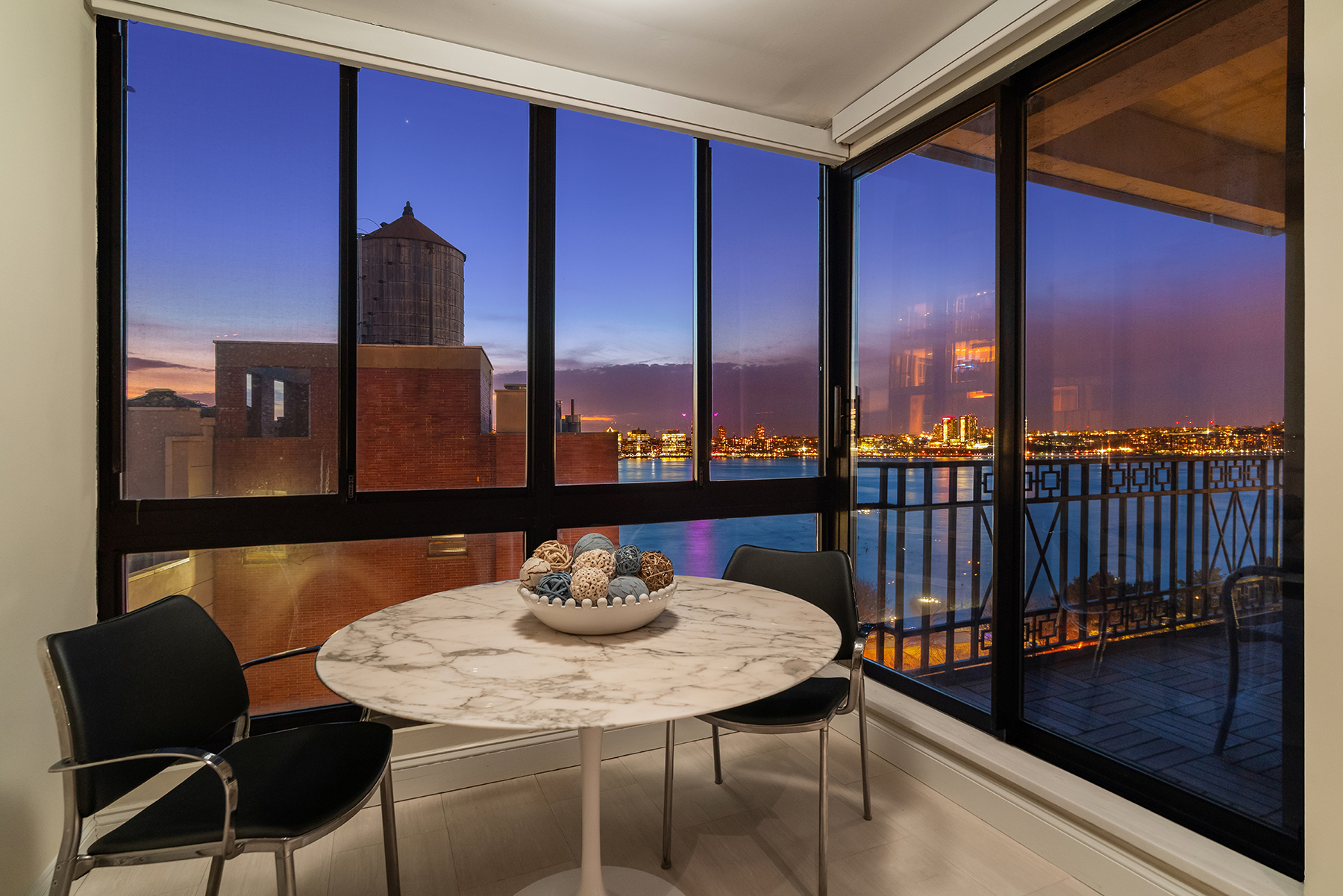 366 West 11th Street, Unit PHF Manhattan, NY 10014 - Photo 12 of 28 a view of a dining room with furniture and window