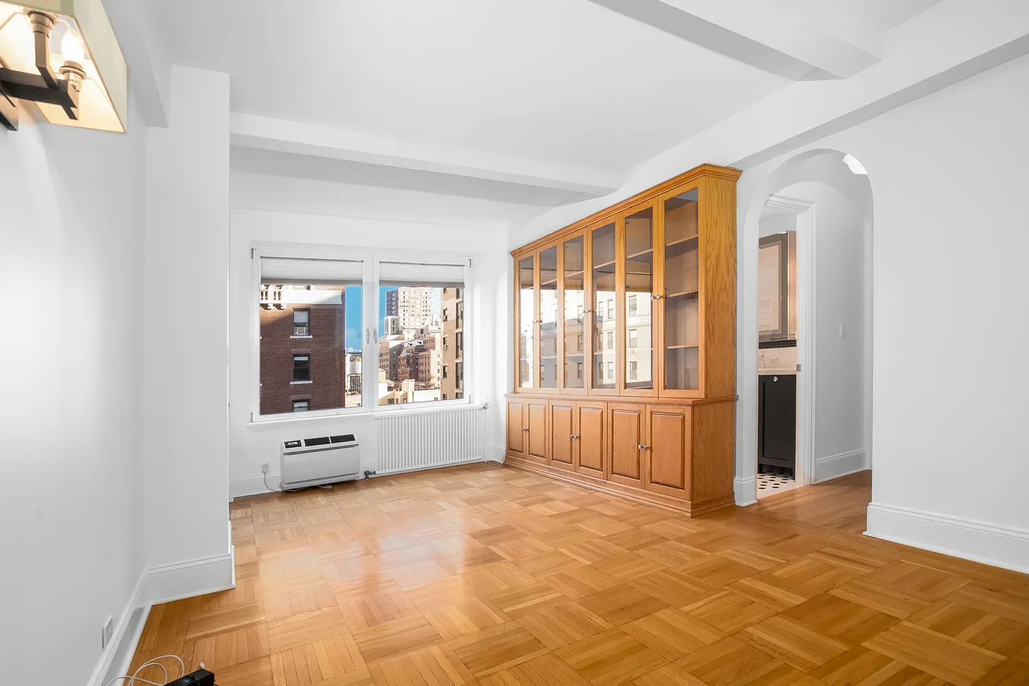 a view of an empty room with a window