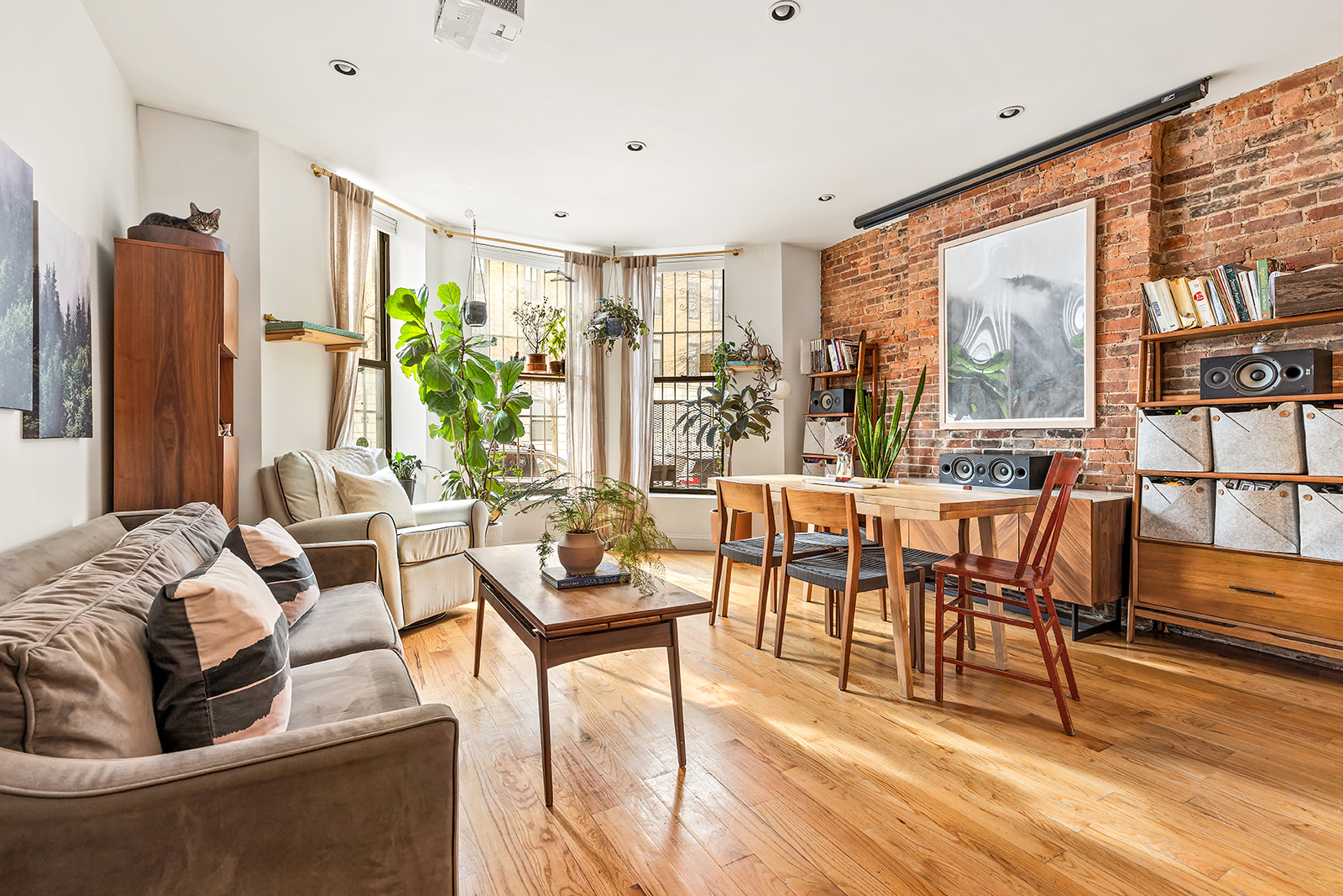 1153 Pacific Street, Unit 1 Brooklyn, NY 11216 - Photo 1 of 11 a living room with furniture and a large window