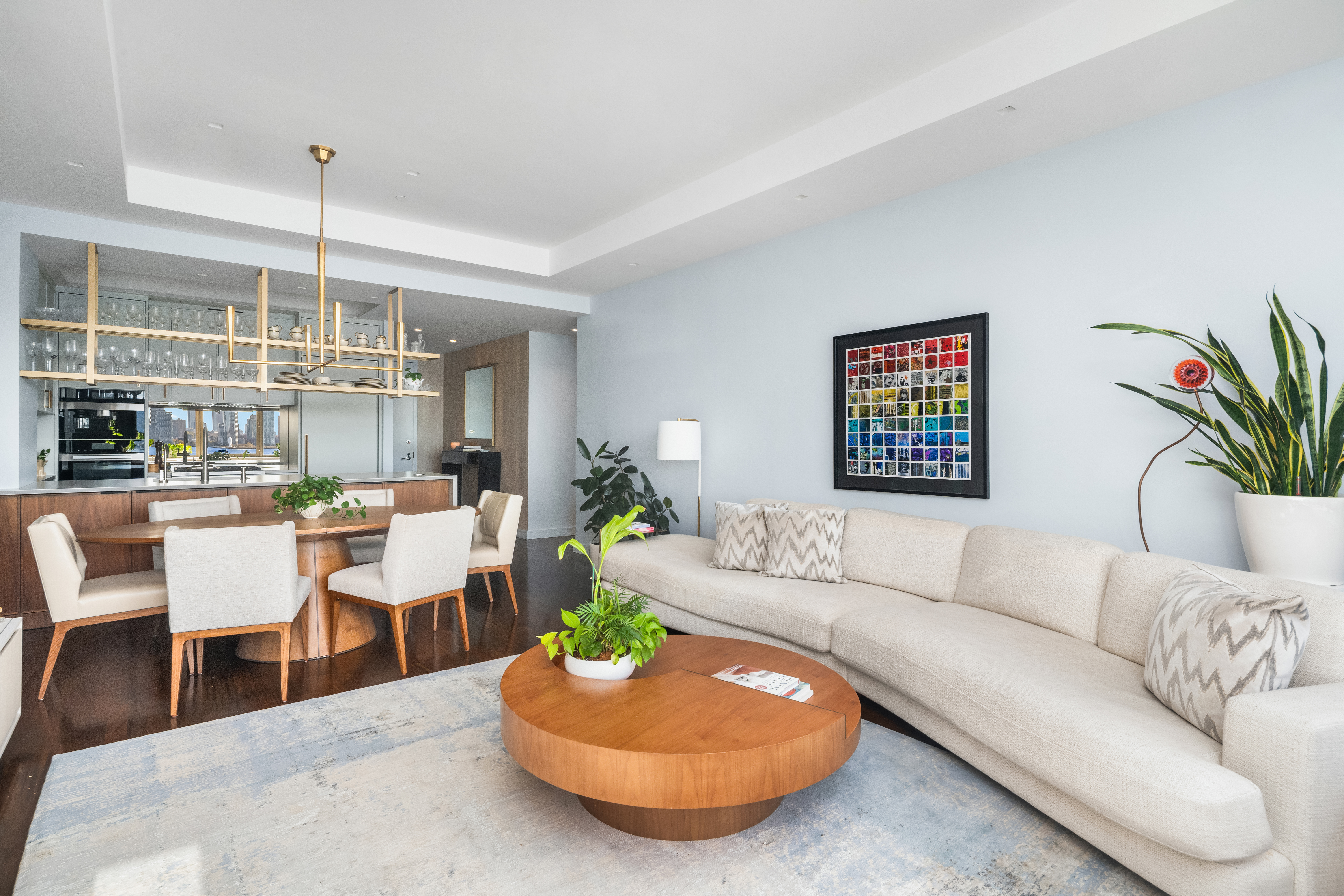 100 Morton Street, Unit 7EW Manhattan, NY 10014 - Photo 4 of 21 a living room with furniture and a potted plant