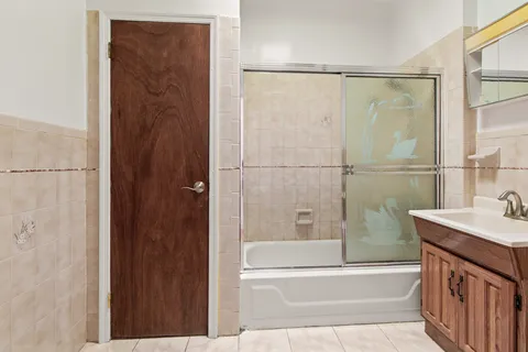 a picture of a bathroom with mirror