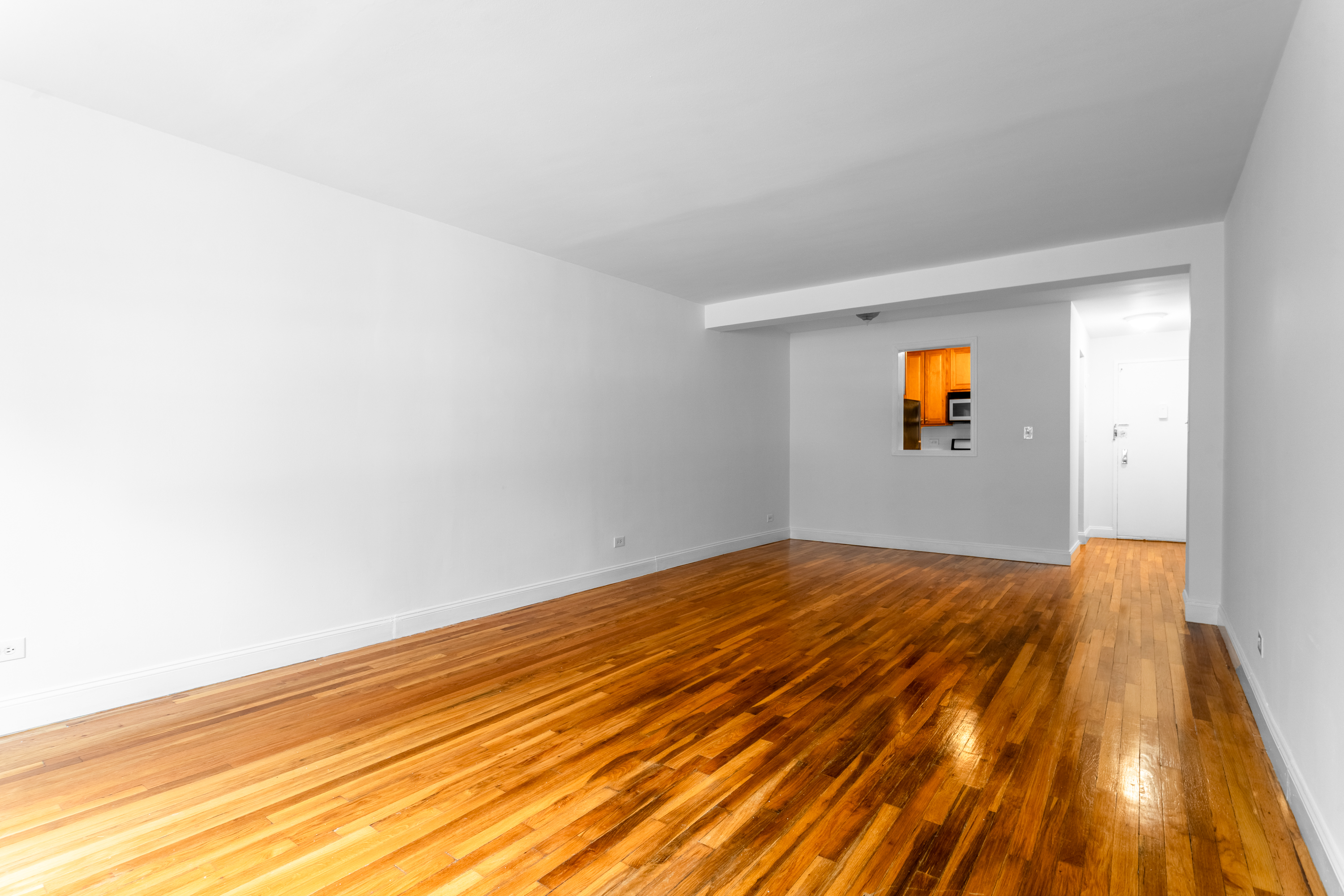 2750 Johnson Avenue, Unit 6E Bronx, NY 10463 - Photo 5 of 14 a view of an empty room and wooden floor