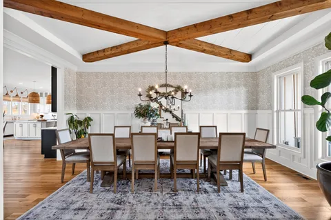 a view of a dining room with furniture window and wooden floor