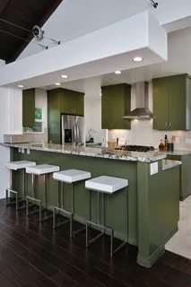 a kitchen with granite countertop a sink and a stove top oven