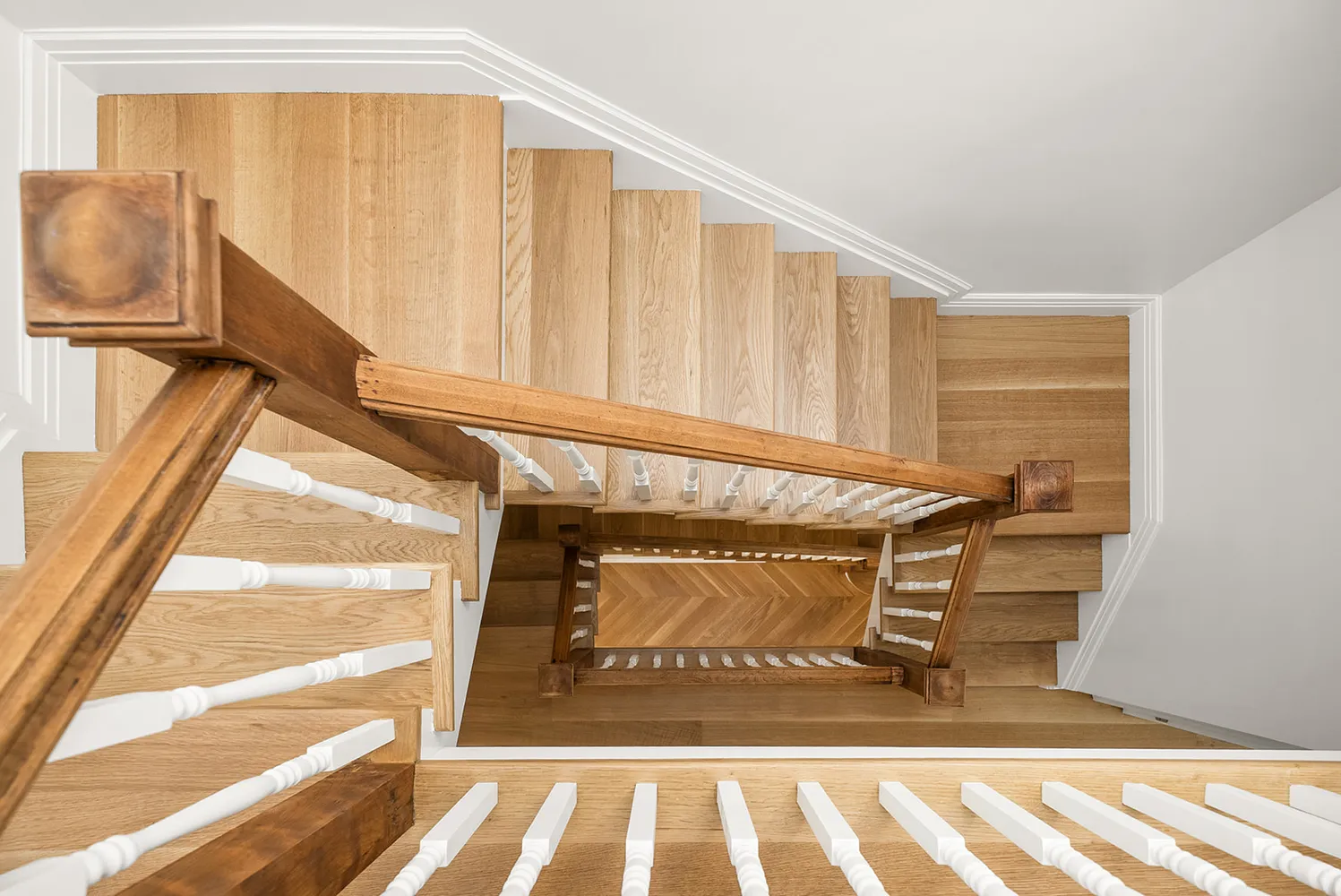 a view of an empty room with stairs and toys