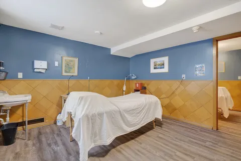 a white toilet sitting next to a bathroom sink