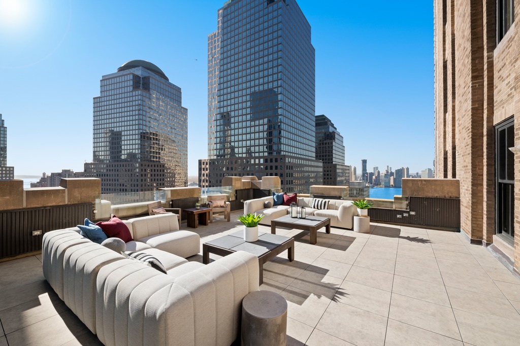 100 Barclay Street, Unit 21AD Manhattan, NY 10007 - Photo 4 of 40 a view of roof deck with seating space and city view