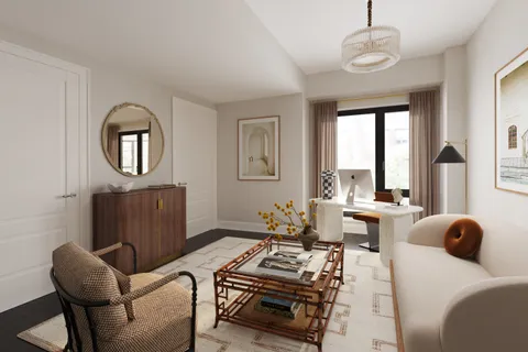 a bedroom with furniture and a wooden floor