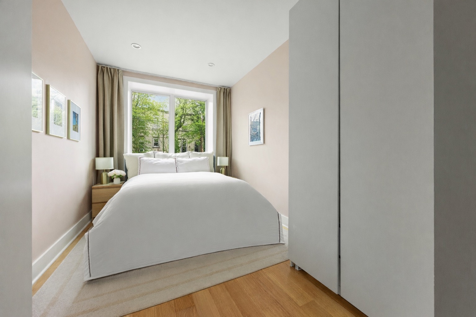 473 Bainbridge Street, Unit 1 Brooklyn, NY 11233 - Photo 7 of 15 a bed room with a bed and a large window