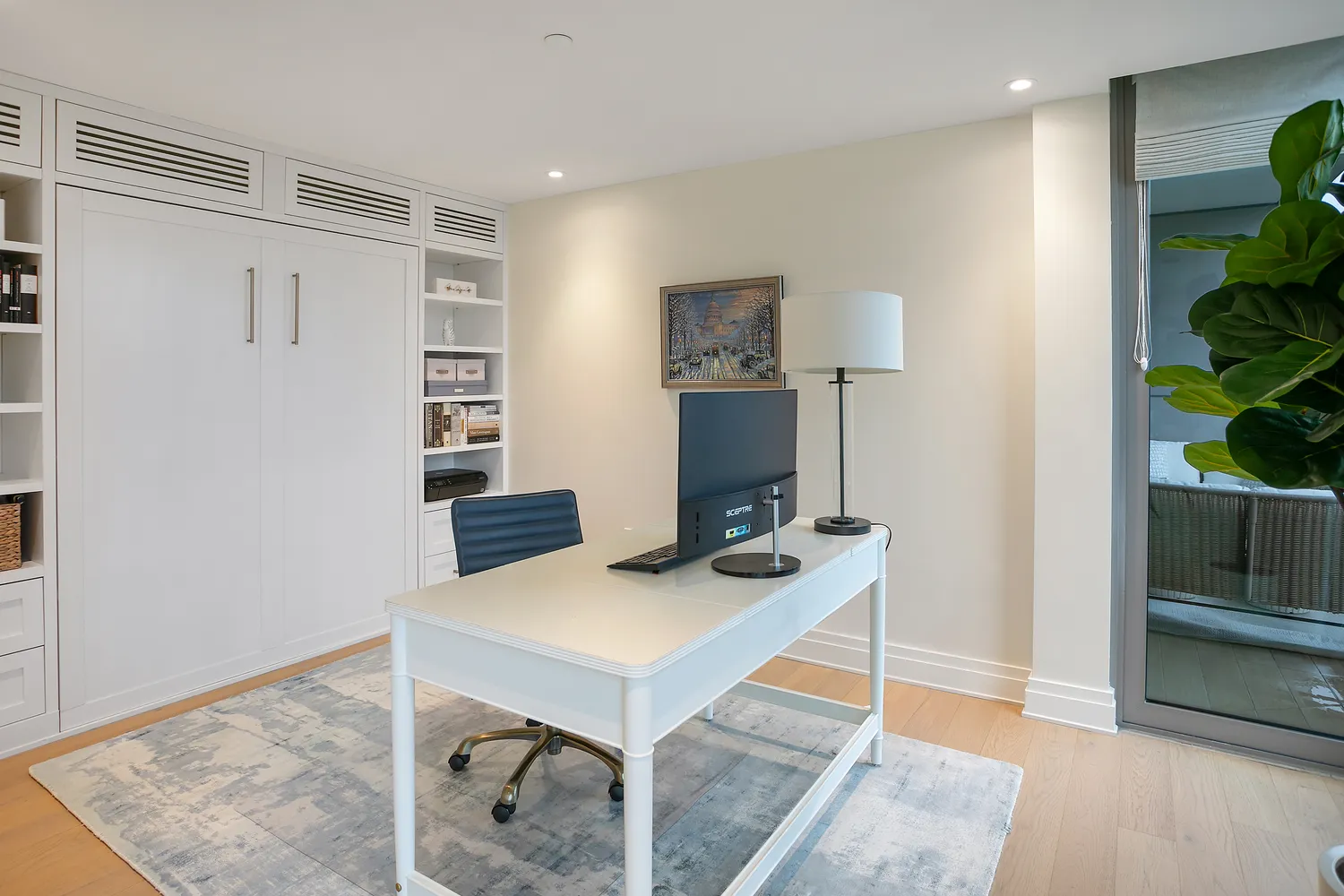 a workspace with furniture and a potted plant