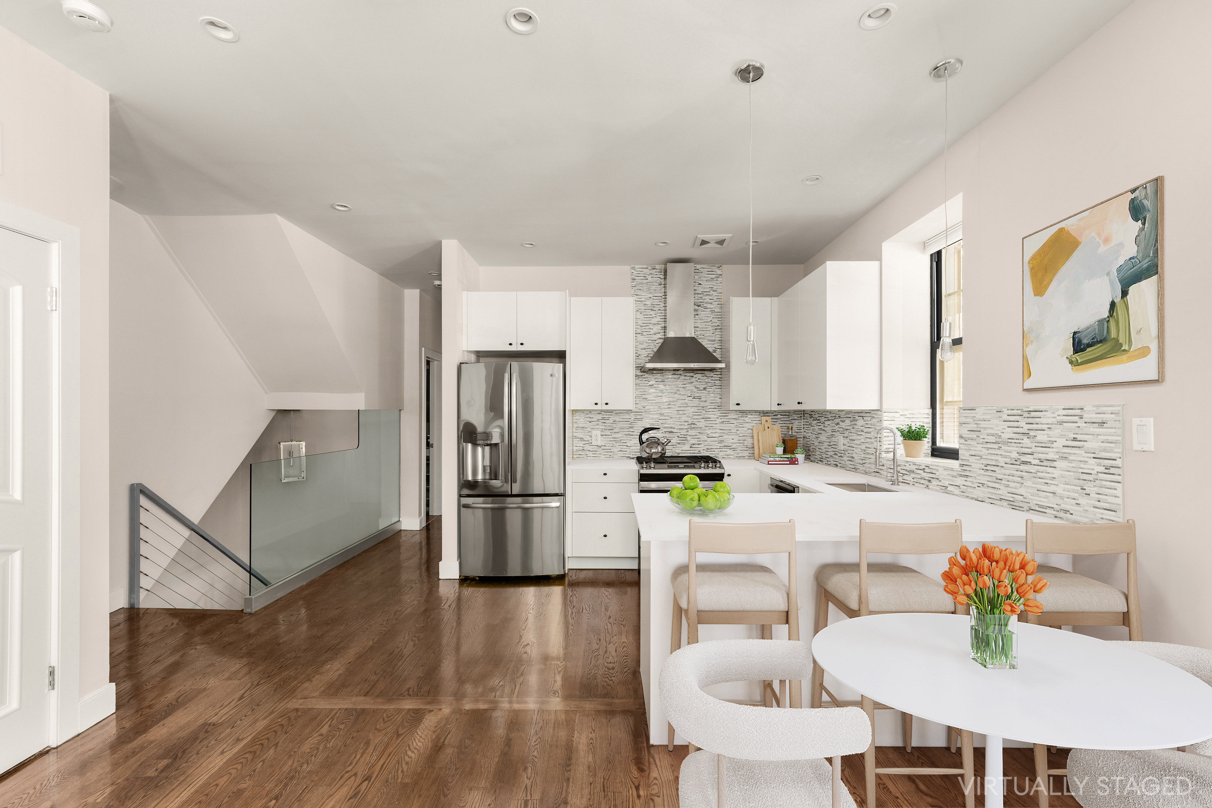 71 Irving Place, Unit 1 Brooklyn, NY 11238 - Photo 2 of 14 a kitchen with a dining table chairs and refrigerator