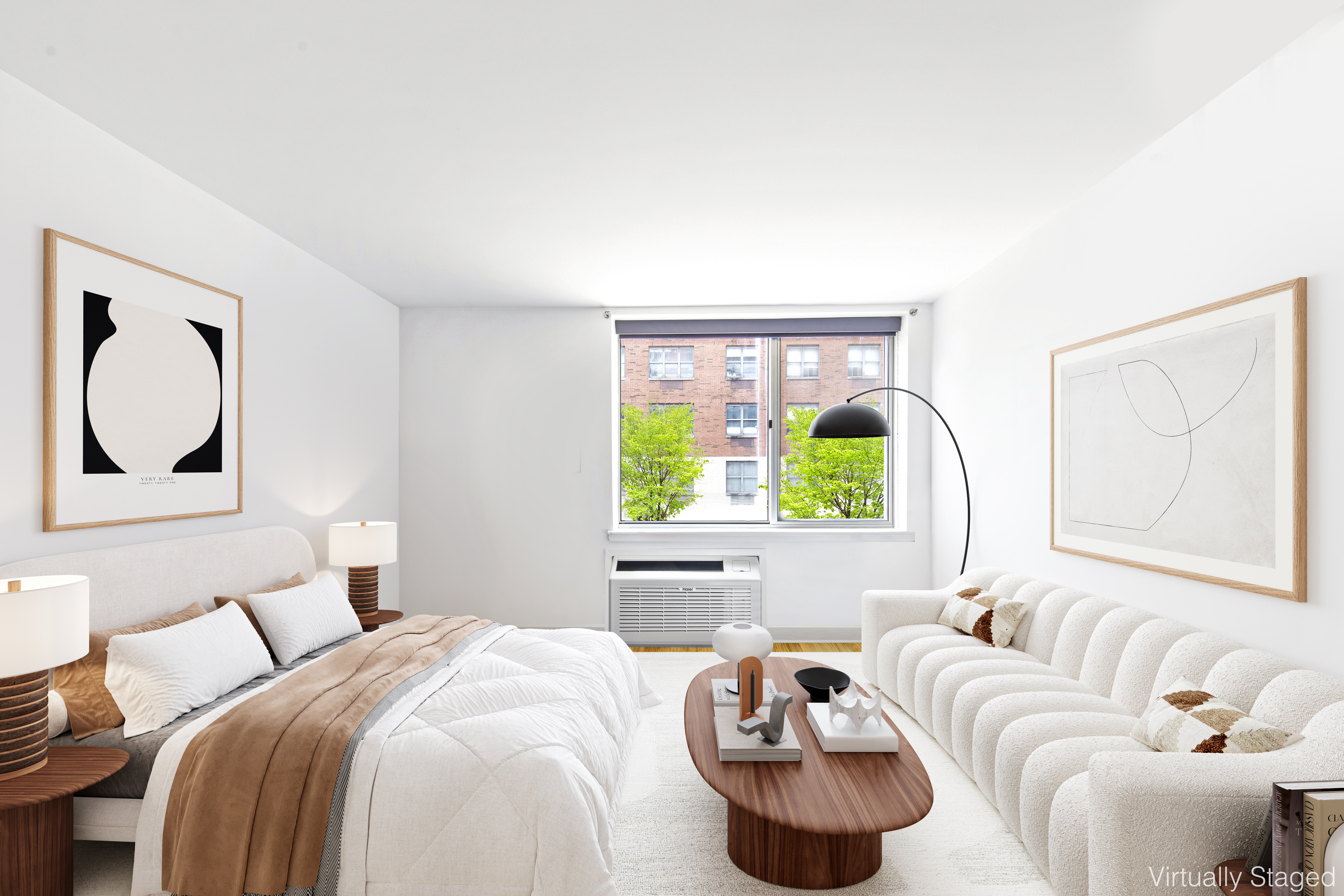 505 West 47th Street, Unit 2BS Manhattan, NY 10036 - Photo 2 of 5 a bedroom with a bed and a large window