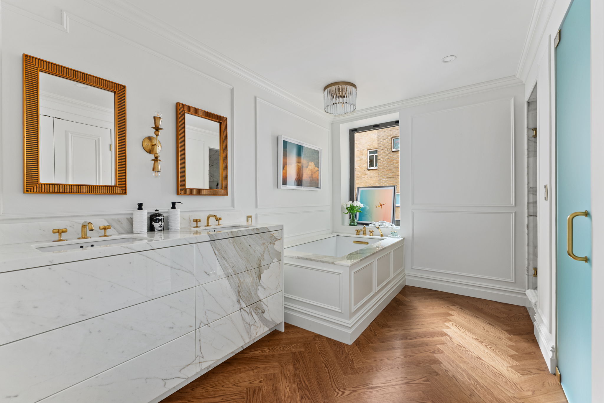 230 Central Park South, Unit 6DE Manhattan, NY 10019 - Photo 12 of 23 a bathroom with a double vanity sink a mirror and a bathtub